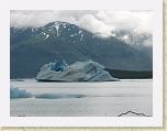 Alaska 282 * This immense iceberg drifted and spun in circles far off the shore of our island.  See movie also. * This immense iceberg drifted and spun in circles far off the shore of our island.  See movie also. * 2816 x 2112 * (1.47MB)